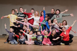 Author Eileen Boggess (third from top right), director Jessica Sheridan (bottom left), and Davenport Junior Theatre's Mia the Melodramatic team