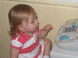 Gwen at the cash register