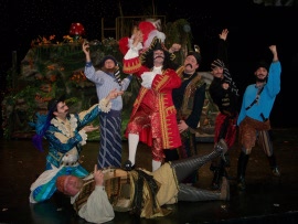 Tom Walljasper (center) and ensemble members in Peter Pan
