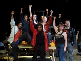 ensemble members in the Clinton Area Showboat Theatre's Rent