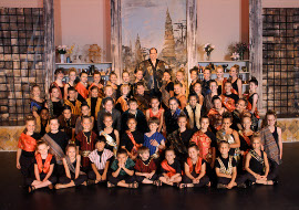 Jonathan Schrader (top) and the king's children in The King & I