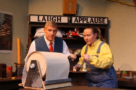 Jim Driscoll and Sara Laufer in Quad City Music Guild's A 1940s Radio Christmas Carol, at the Propect Park Auditorium