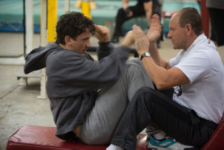 Miles Teller and Aaron Eckhart in Bleed for This