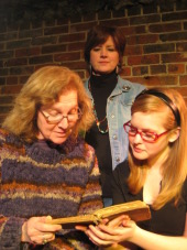 Angela Elliott (standing), with Susan McPeters and Abby Van Gerpen in Eleemosynary