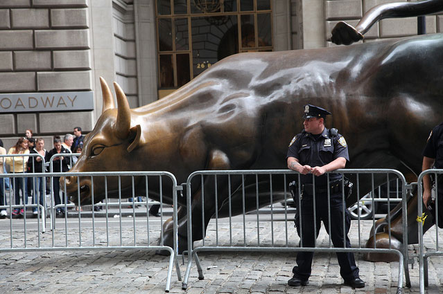 Police Guard Wall Street Bull Duing Occupy Wall Street. 