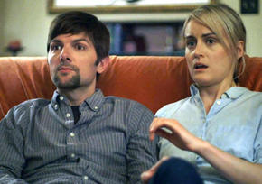 Adam Scott and Taylor Schilling in The Overnight