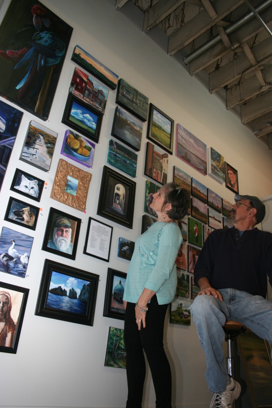 Pat Bereskin and Bruce Bisbey with their month of paintings