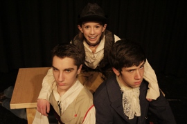 Cole Harksen as Long John Silver, Emily Baker as Jim Hawkins, and Sam Jones as Captain Smollett in Davenport Junior Theatre's Treasure Island