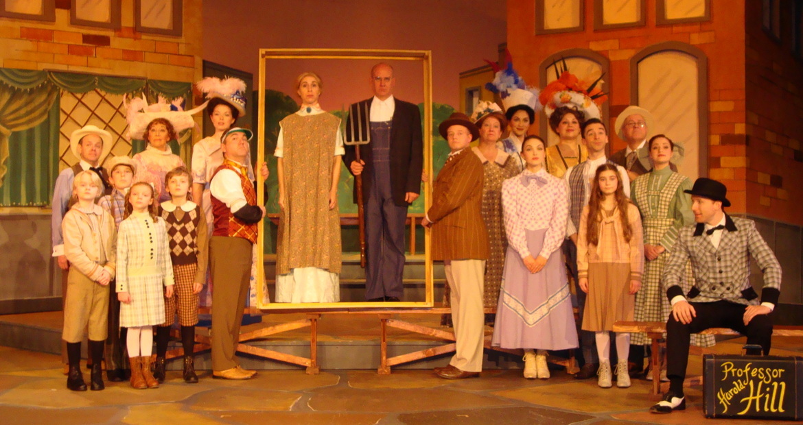 Marc Ciemiewicz, Andrea Moore, Brad Hauskins, and Tristan Tapscott (center), Don Denton (right), and The Music Man ensemble members