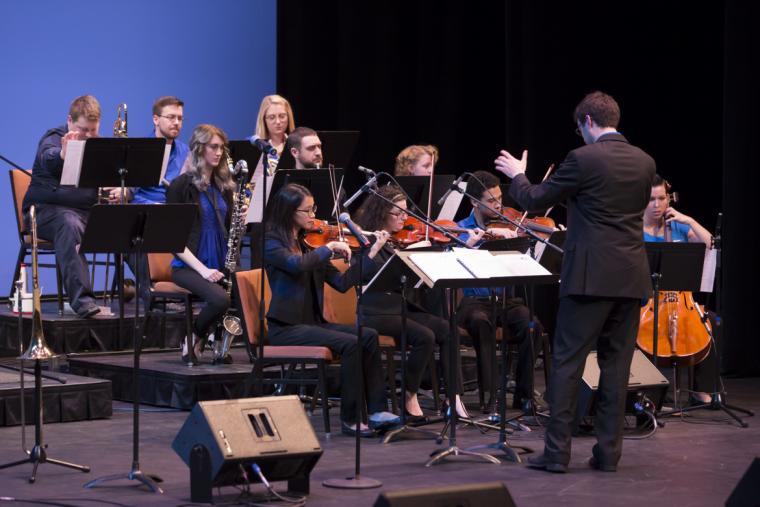 Mike Conrad conducts his All Angles Orchestra