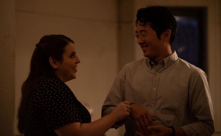 Beanie Feldstein and Steven Yeun in The Humans