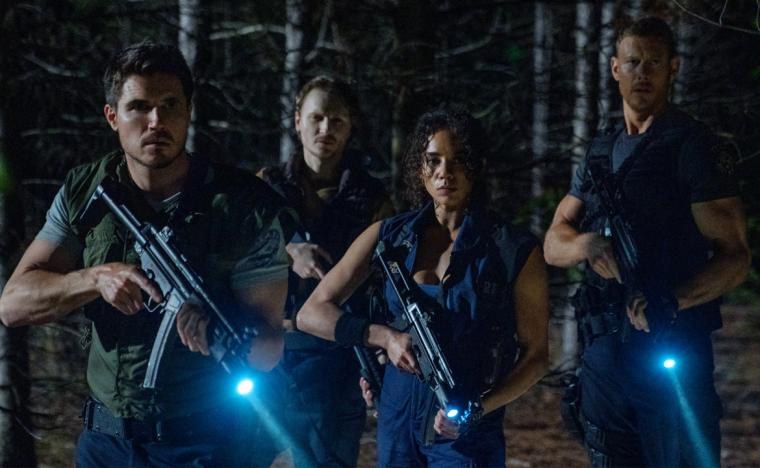 Robbie Amell, Chad Rook, Hannah John-Kamen, and Tom Hopper in Resident Evil: Welcome to Raccoon City