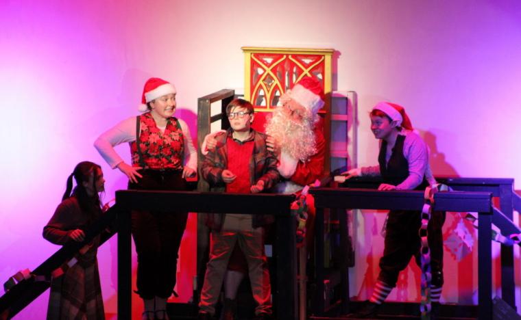 Liam Knobloch, Noah Hill, and ensemble members in A Christmas Story: The Musical
