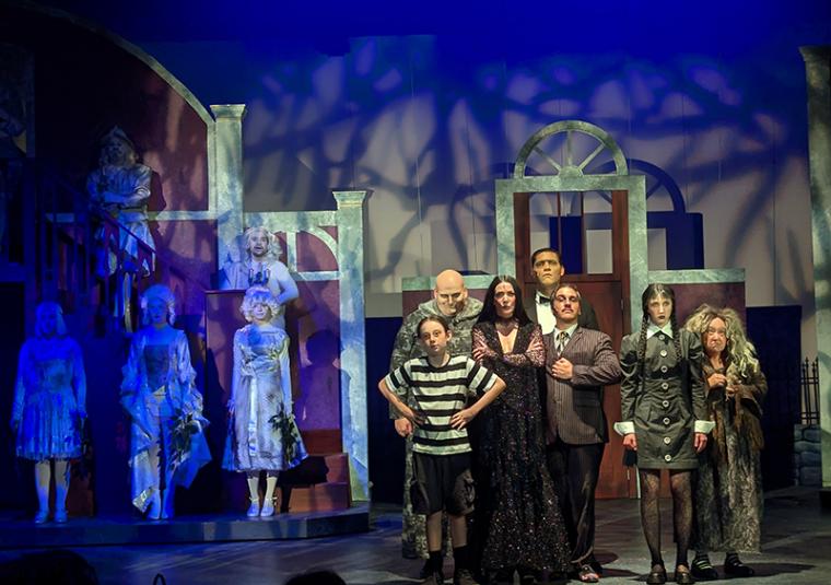 (at left) ensemble members and (at right) Gavin Hook, Marc Christopher, Sarah Hayes, Joshua Ponsones, A.C. Lam, JuJu Palmer, and Shelley Walljaper in The Addams Family