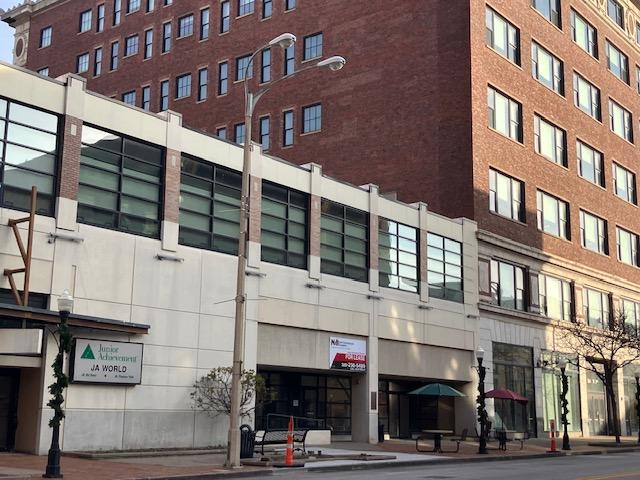 A vacant commercial space at 112 W. 2nd St., Davenport, is expected to house the renovated, expanded Bix Museum, to open by March 2025. The former Wells Fargo Bank branch at right also is vacant. (photo by Jonathan Turner)