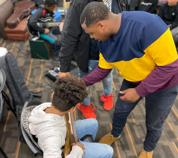 Parker teaches elementary-level students in the InTune Mentorship Program, seen here at Rock Island's Martin Luther King Center.