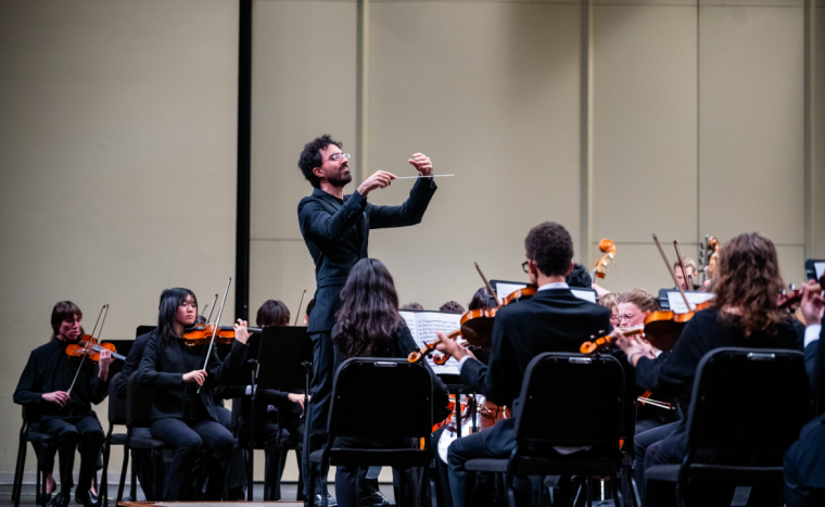 Hisham Bravo Groover conducting the Youth Symphony at the Adler Theatre (photo by Evan Sammons).