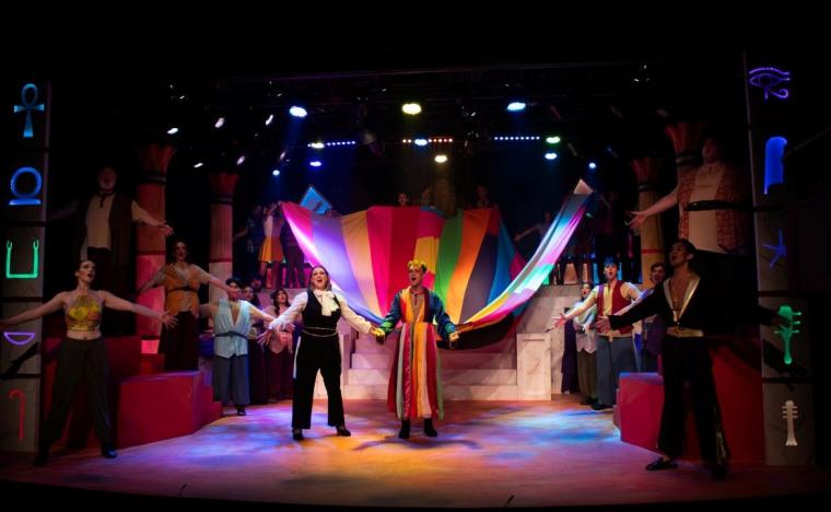 Grace Avery, Dylan Renart, and ensemble members in Joseph & the Amazing Technicolor Dreamcoat