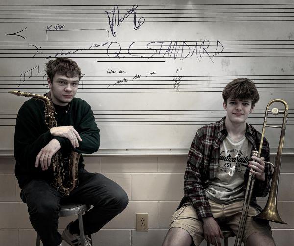 June 29 opening act Q.C. Standard is led by Nathan Anderson (saxophone) and Zach McMann (trombone), who will be North Scott High seniors this fall.