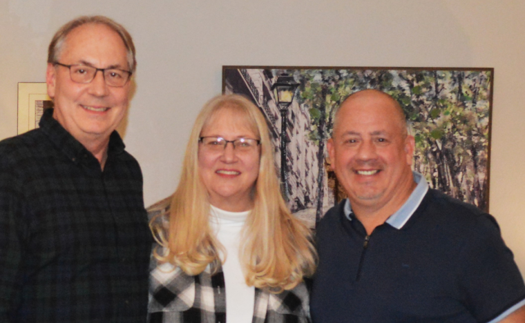 Kelly Rundle, left, with his wife Tammy and Brian Munos (John Munos' great nephew)