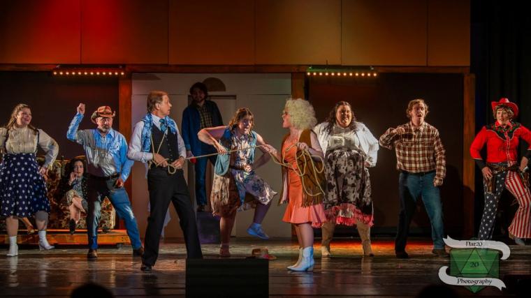Kevin Pieper, Katie Griswold, and ensemble members in 9 to 5: The Musical (photo by Nat20 Photography)