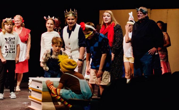 Reina Ramos-Paulson (as the Ugly Duckling) and ensemble members in The Stinky Cheese Man & Other Fairly Stupid Tales