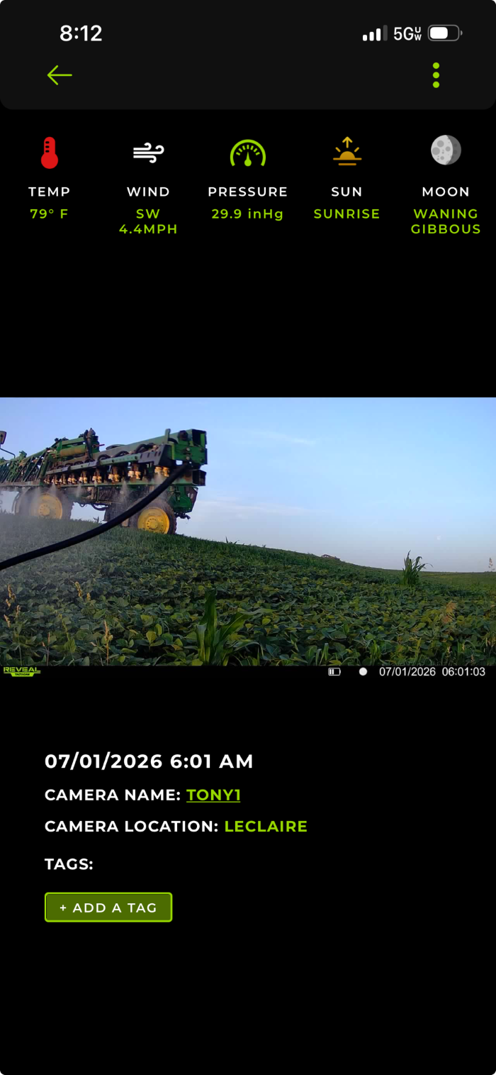 Webcam screen shot of spraying in field adjacent to Tony Singh's oak tree savanna: July 1, 2026